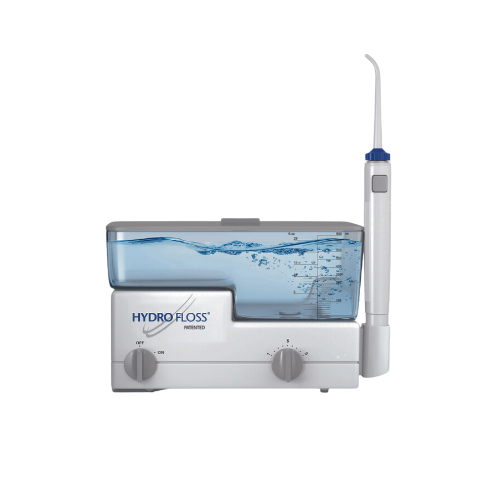 The image shows a Hydro Floss oral irrigator with a water reservoir, a dental tip, and control buttons.